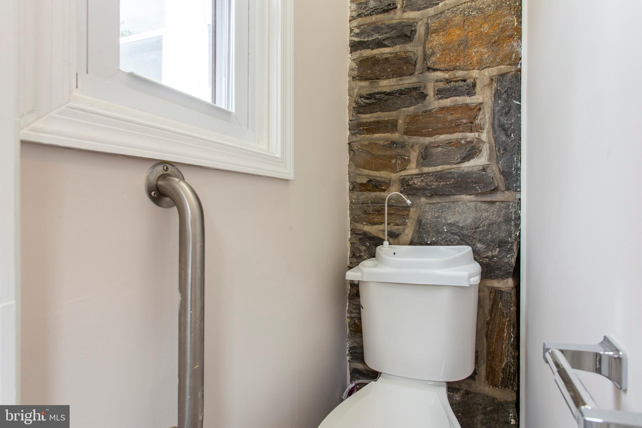 6127 Nassau Road Philadelphia, PA 19151 - Photo 17 of 39 Half bath between kitchen and rear door