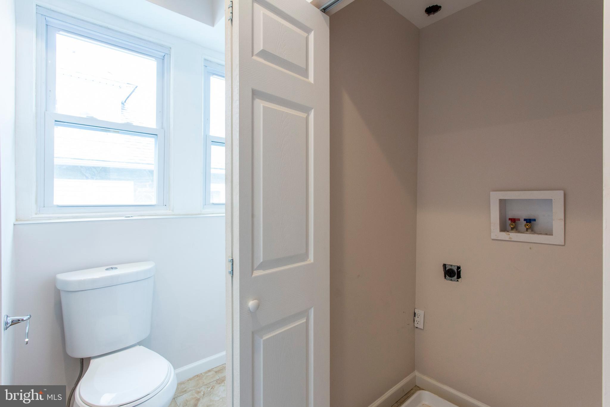 6127 Nassau Road Philadelphia, PA 19151 - Photo 26 of 39 Laundry hookup in hall bath