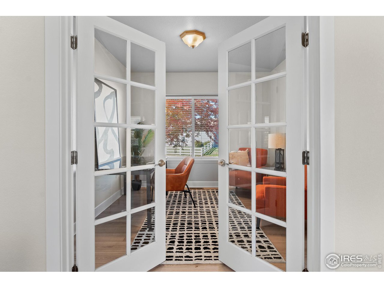 2002 Trail Ridge Drive Severance, CO 80615 - Photo 12 of 38 a picture of a room with wooden floor and windows