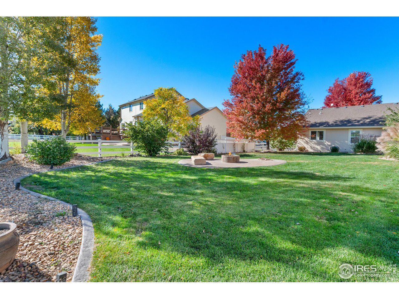 2002 Trail Ridge Drive Severance, CO 80615 - Photo 22 of 38 a garden with trees in front of it