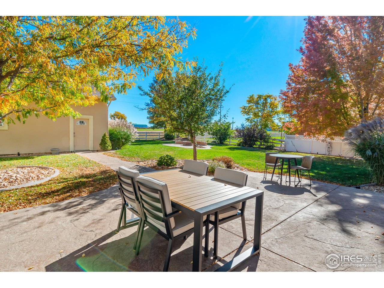 2002 Trail Ridge Drive Severance, CO 80615 - Photo 24 of 38 a view of a patio with a table and chairs