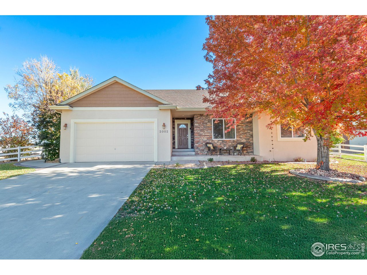 2002 Trail Ridge Drive Severance, CO 80615 - Photo 26 of 38 a front view of a house with a yard