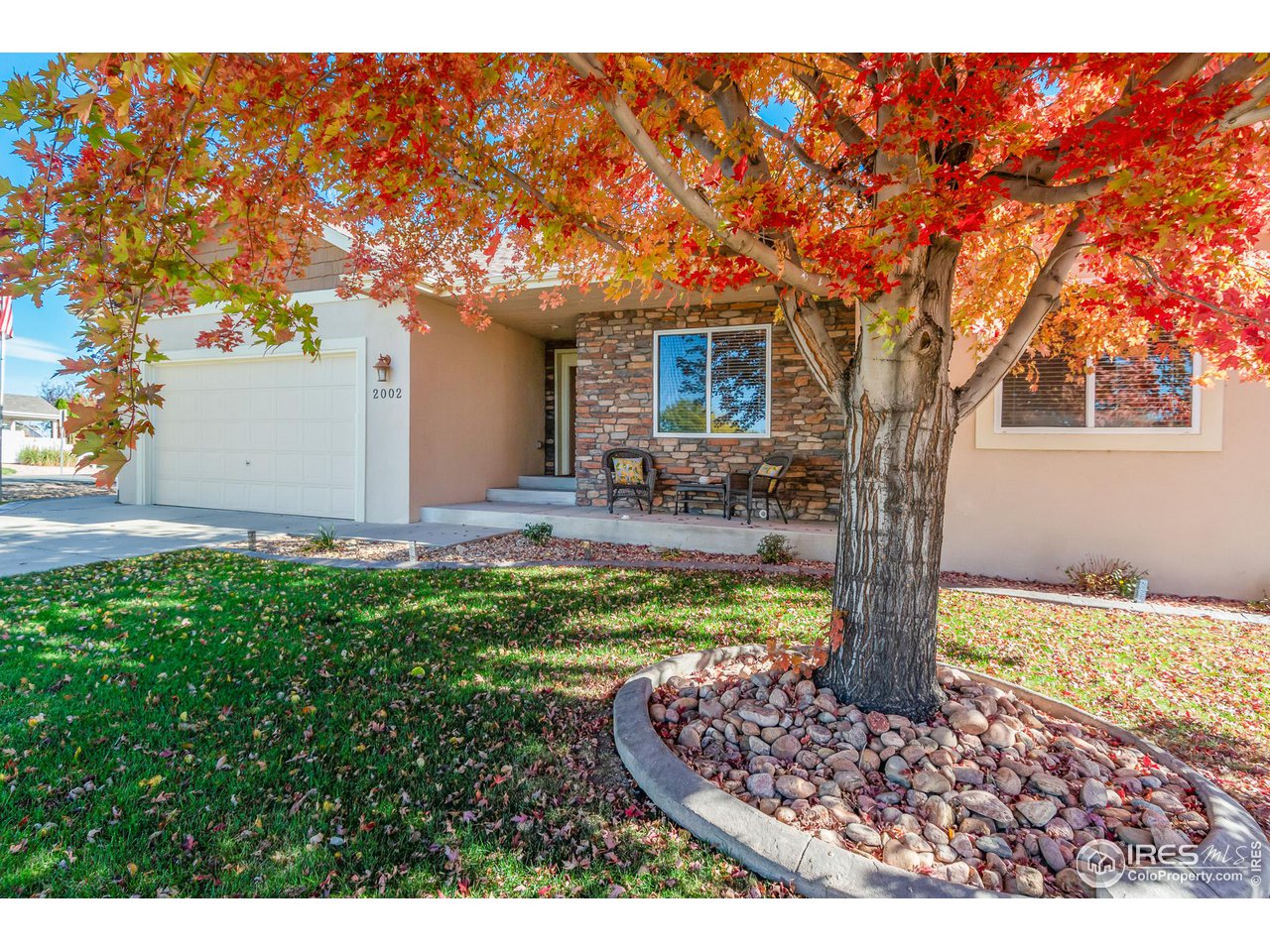 2002 Trail Ridge Drive Severance, CO 80615 - Photo 3 of 38 a front view of a house with garden