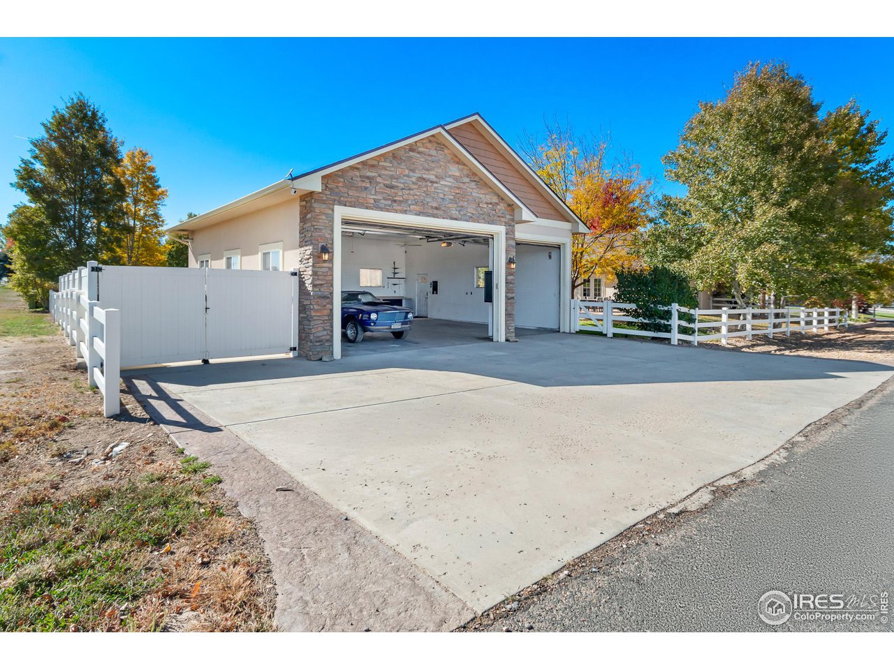 2002 Trail Ridge Drive Severance, CO 80615 - Photo 32 of 38 a view of a house with backyard and trees