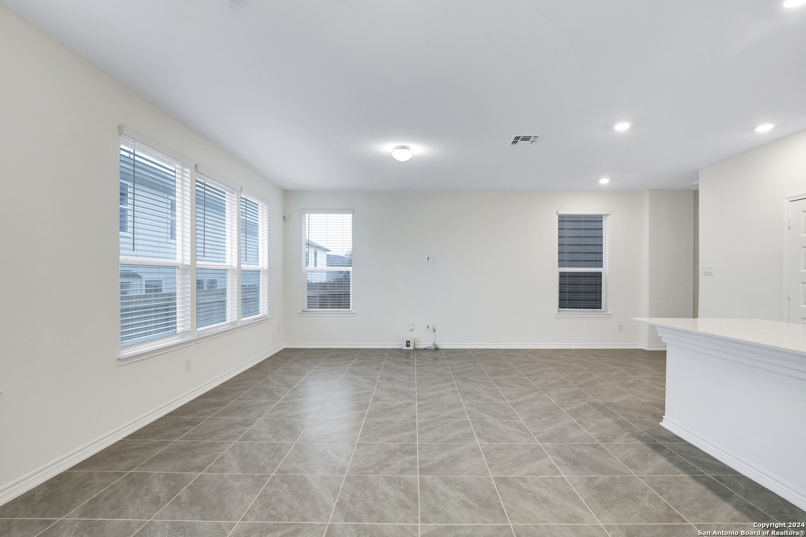 14839 Vance Jackson Road, Unit 416 San Antonio, TX 78249 - Photo 4 of 5 a view of an empty room with a window