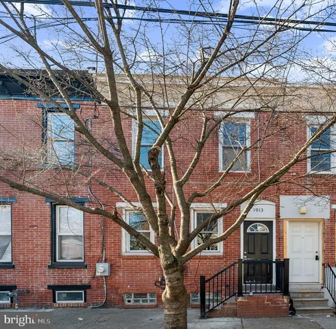 a building view with a tree
