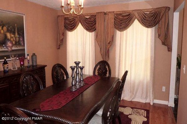217 Alpine Road Henryville, PA 18332 - Photo 3 of 15 a view of a dining room with furniture window and wooden floor