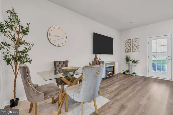 a view of a livingroom with furniture and a potted plant