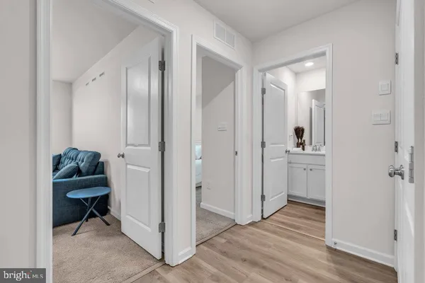 a view of a bathroom with sink and mirror
