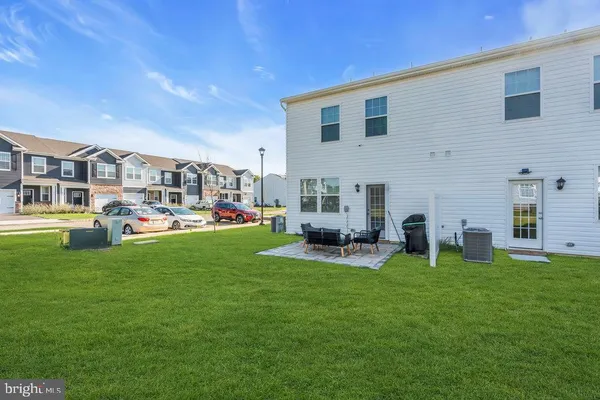 a group of cars parked in front of a house