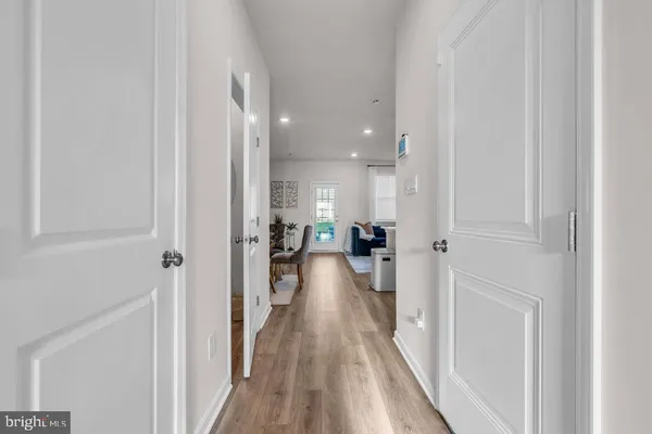 a view of a living room with bathroom