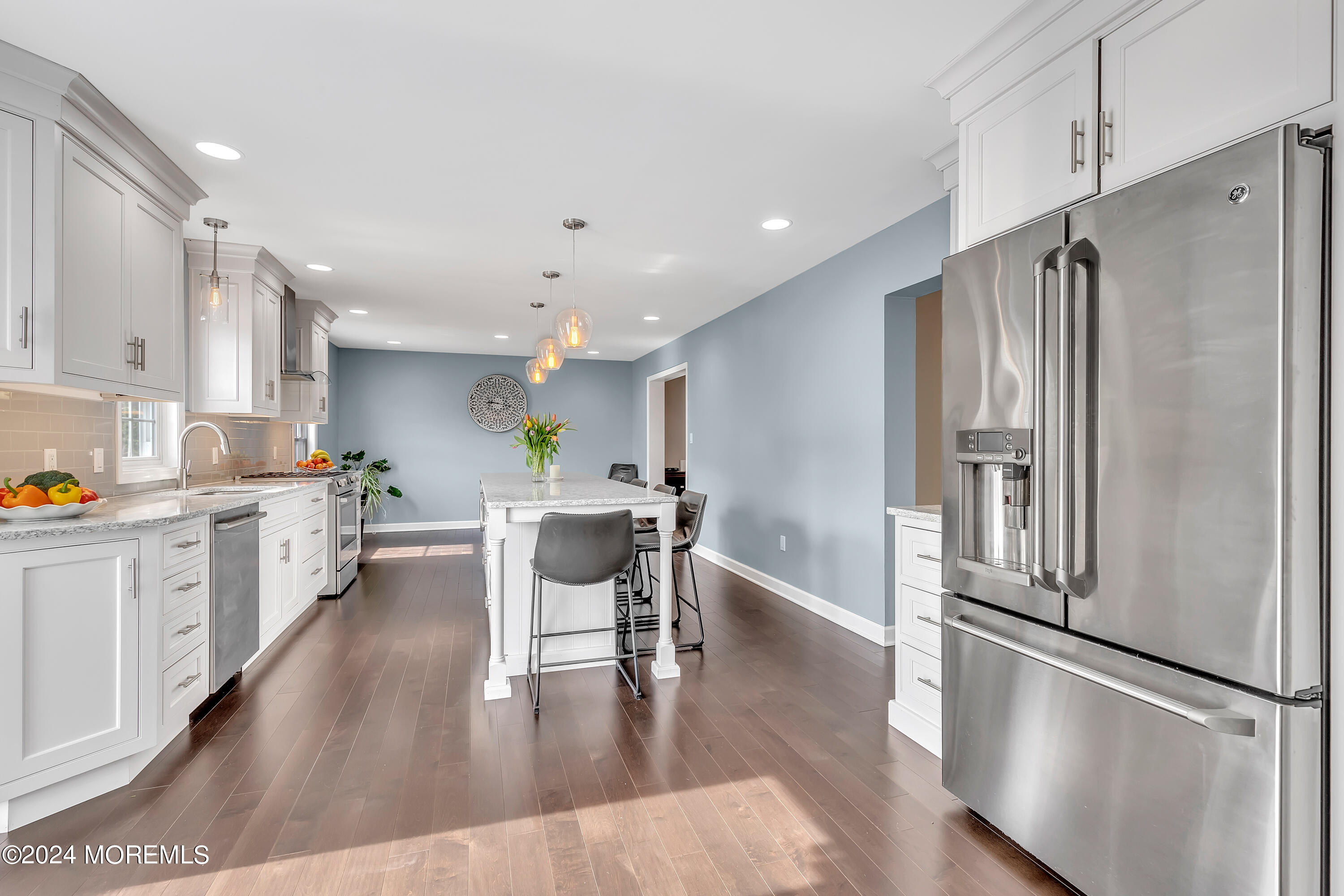 60 Chambers Road Cream Ridge, NJ 08514 - Photo 13 of 51 a kitchen with stainless steel appliances granite countertop a refrigerator a sink dishwasher a stove and white cabinets with wooden floor