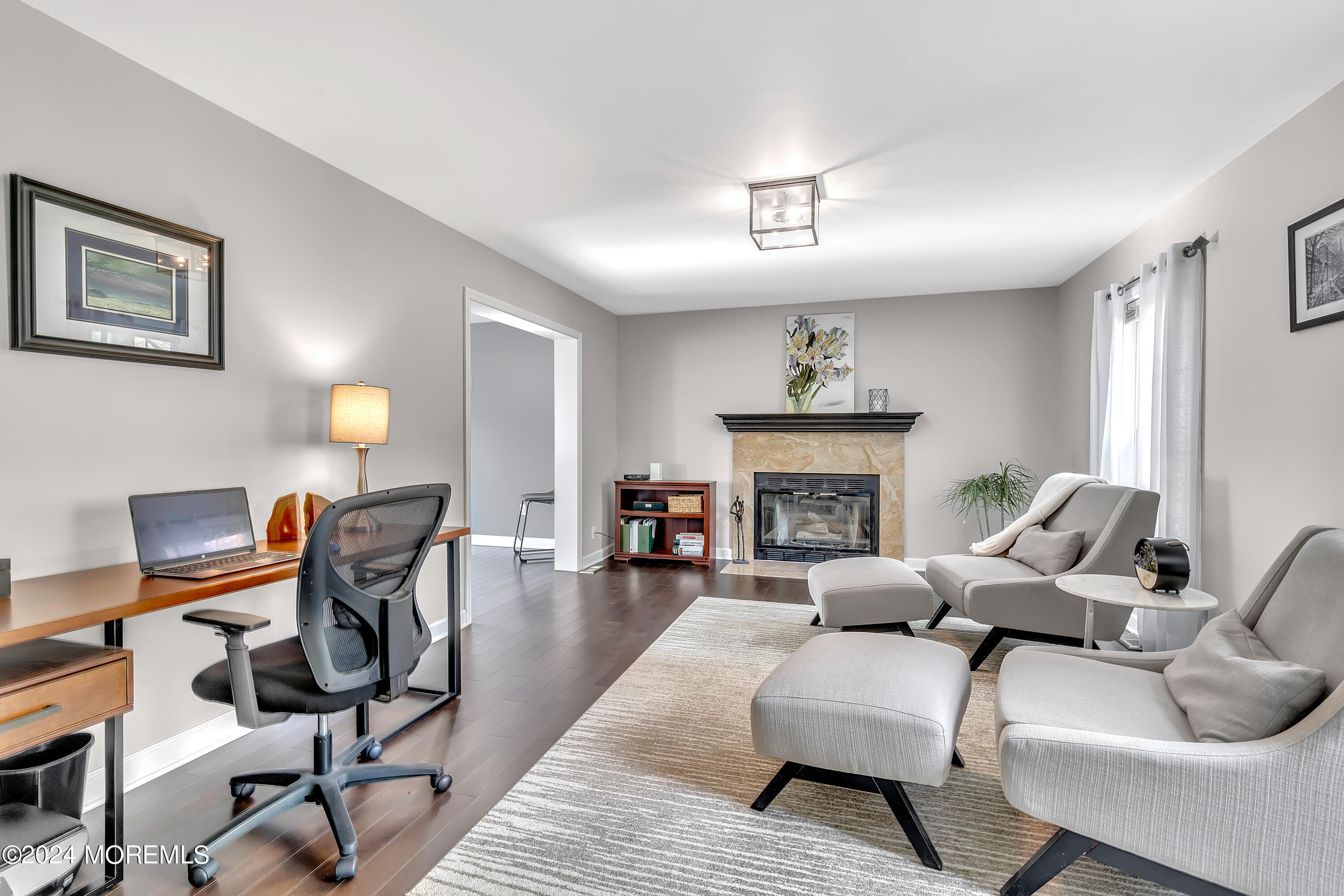 60 Chambers Road Cream Ridge, NJ 08514 - Photo 25 of 51 a living room with furniture a fireplace and a chandelier