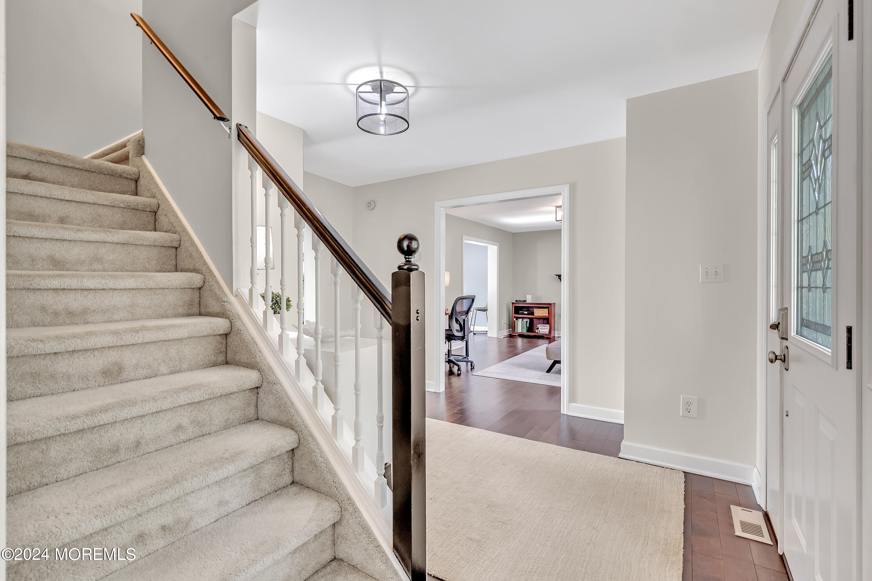 60 Chambers Road Cream Ridge, NJ 08514 - Photo 26 of 51 a view of staircase with lots of frames and a rug