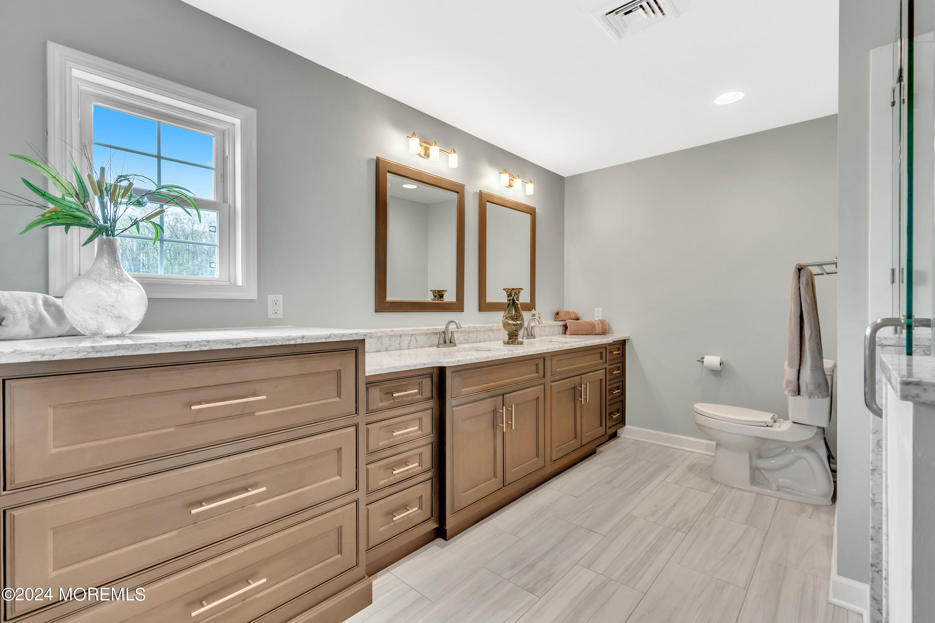 60 Chambers Road Cream Ridge, NJ 08514 - Photo 32 of 51 a spacious bathroom with a granite countertop sink a toilet and a mirror