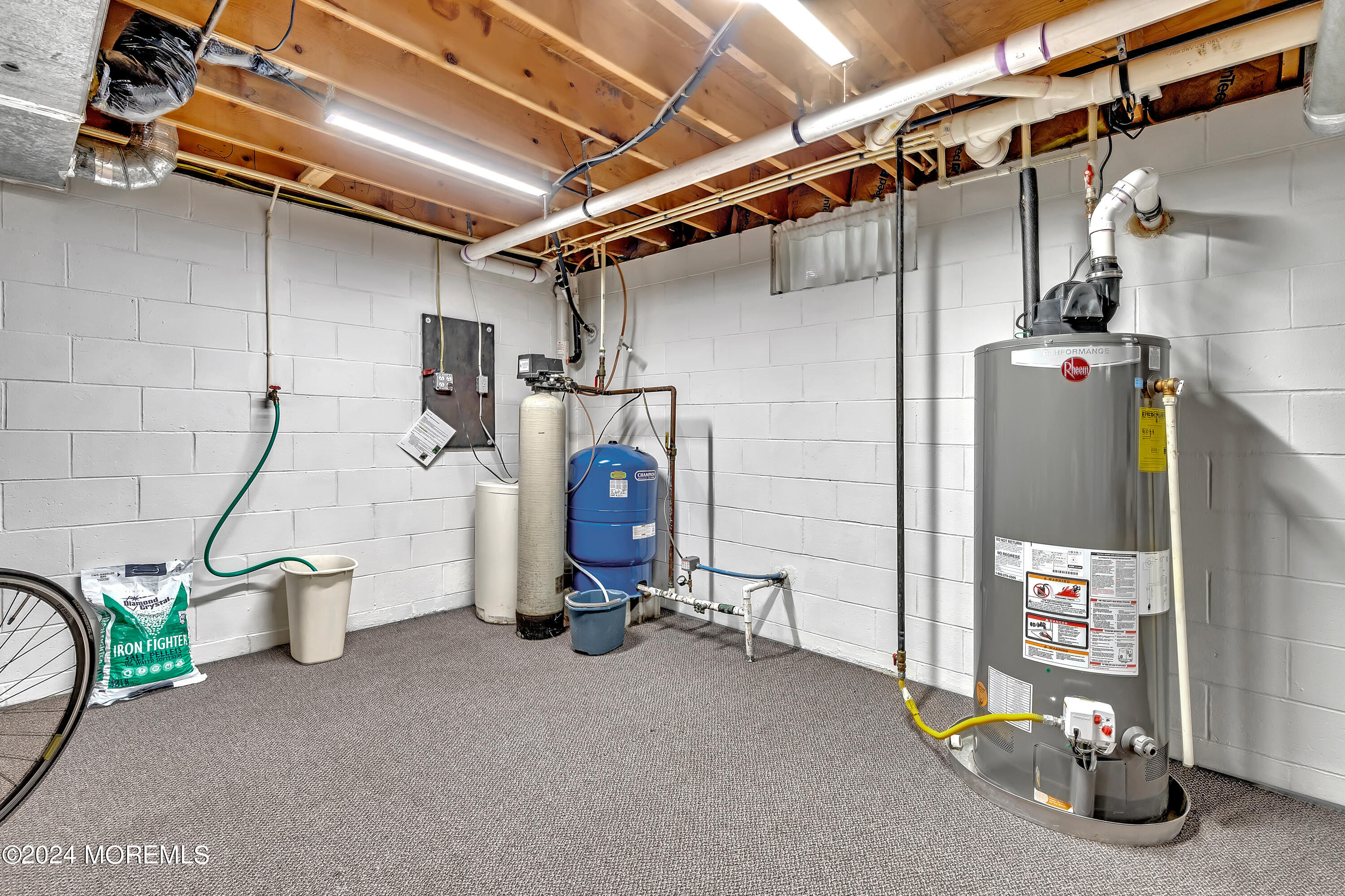 60 Chambers Road Cream Ridge, NJ 08514 - Photo 36 of 51 a view of a storage room with water heater and racks