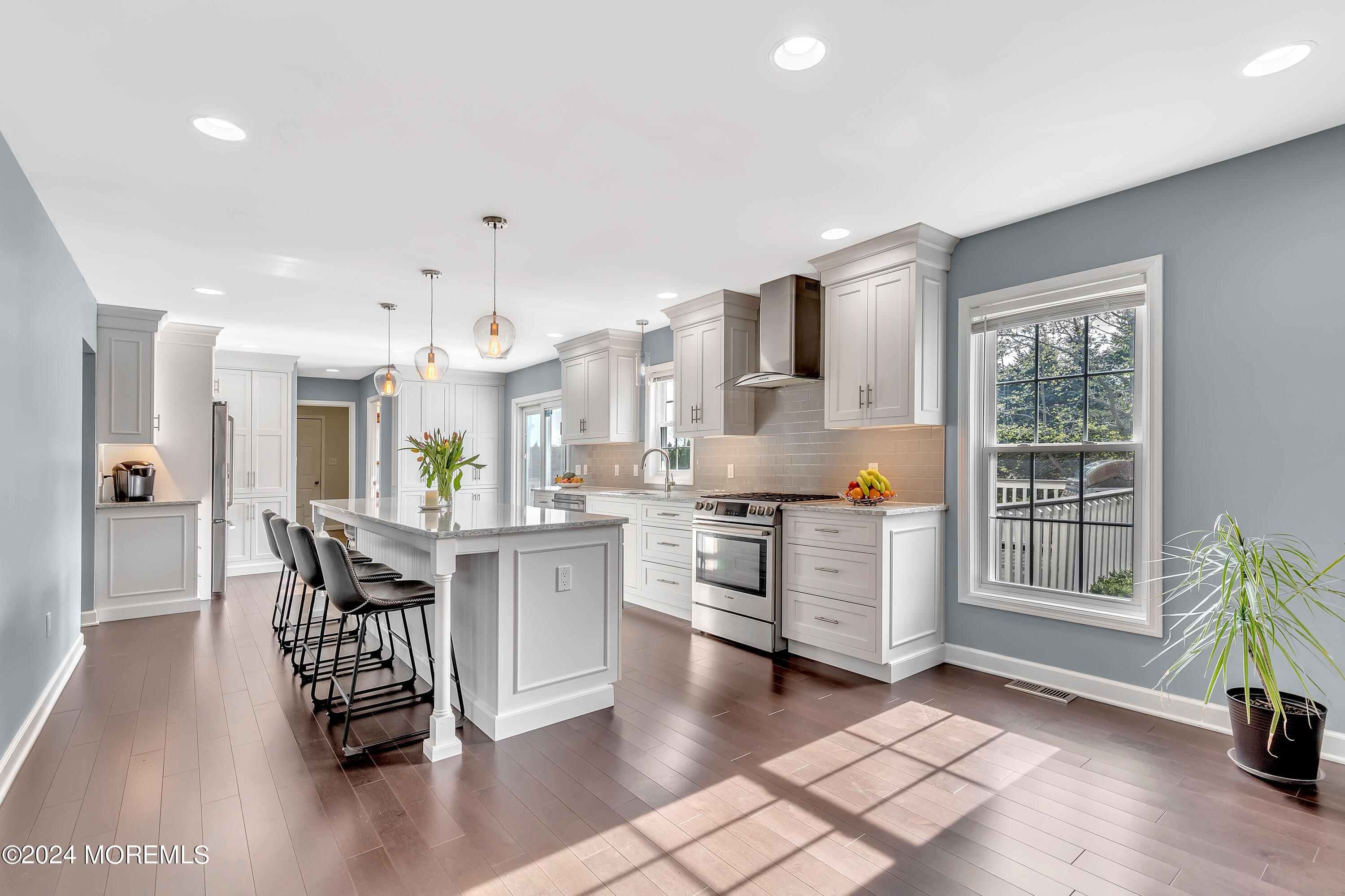 60 Chambers Road Cream Ridge, NJ 08514 - Photo 8 of 51 a kitchen with stainless steel appliances granite countertop a stove top oven a sink a dining table and chairs with wooden floor
