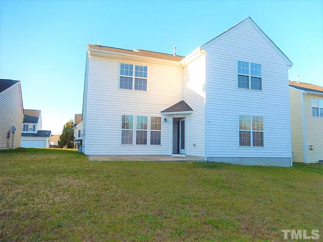 a view of a house with a garden