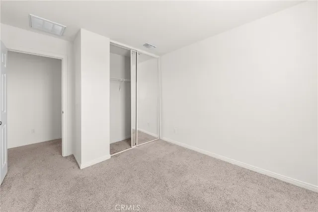 a backyard of a house with outdoor seating