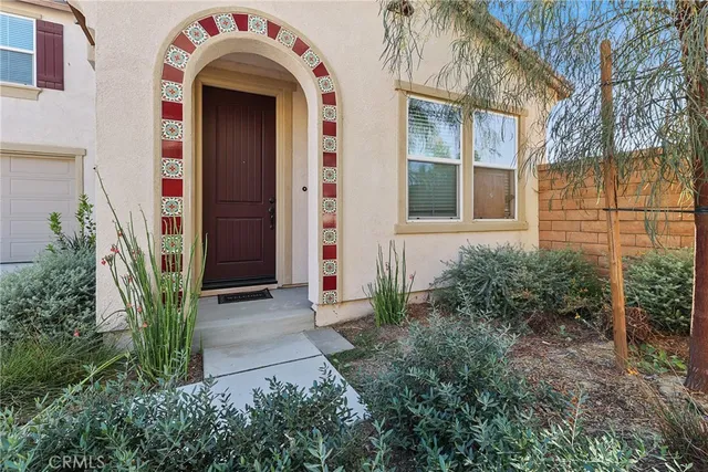 a front view of a house with garden