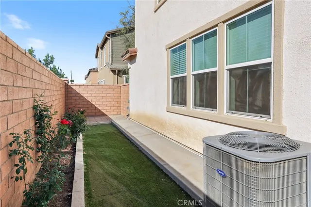a front view of a house with a iron gate