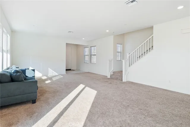 a living room with furniture and a couch