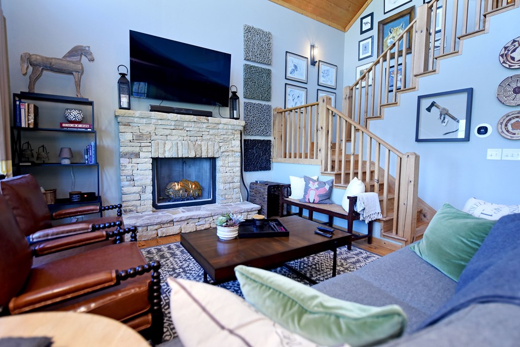 299 Bethabara View Hayesville, NC 28904 - Photo 21 of 131 a living room with furniture fireplace and flat screen tv