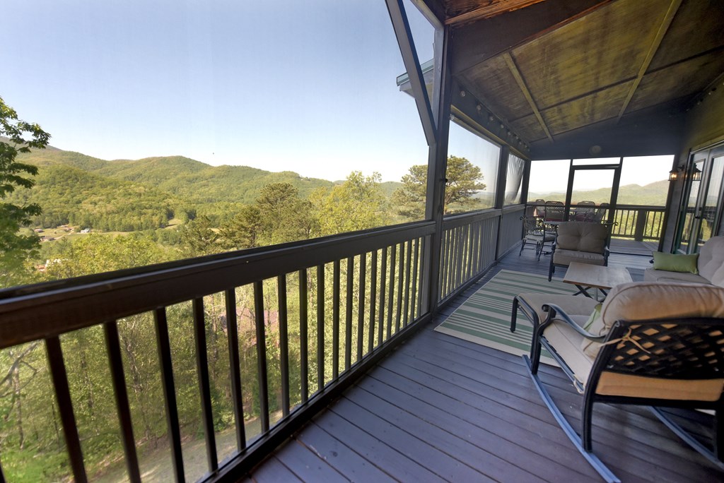 299 Bethabara View Hayesville, NC 28904 - Photo 38 of 131 a view of balcony with couch and wooden floor