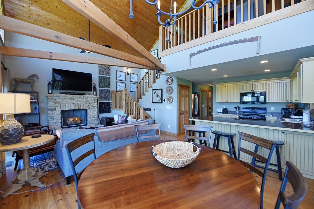 299 Bethabara View Hayesville, NC 28904 - Photo 40 of 131 a living room with fireplace furniture and a flat screen tv