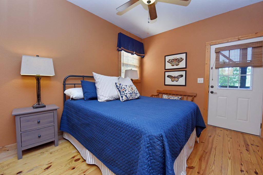 299 Bethabara View Hayesville, NC 28904 - Photo 47 of 131 a bedroom with a bed and a lamp on dresser
