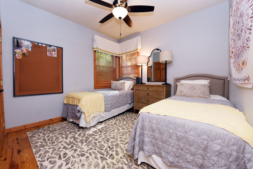 299 Bethabara View Hayesville, NC 28904 - Photo 49 of 131 a bedroom with two beds and chandelier