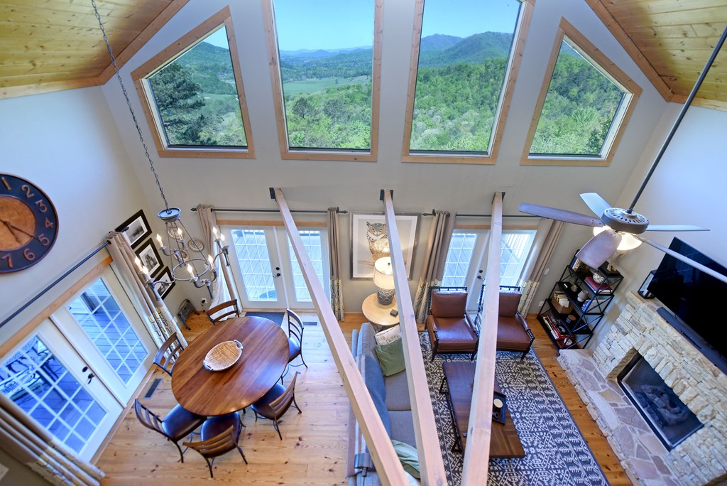 299 Bethabara View Hayesville, NC 28904 - Photo 54 of 131 a view of a dining room with furniture wooden floor and a chandelier