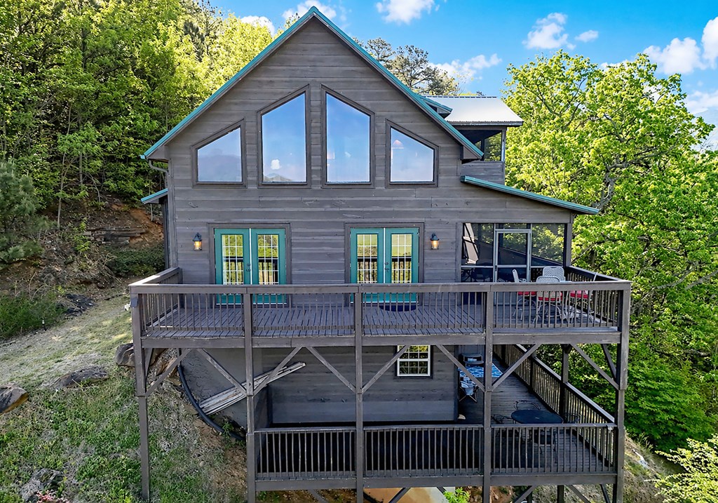 299 Bethabara View Hayesville, NC 28904 - Photo 6 of 131 a view of house with a yard and hanging chair
