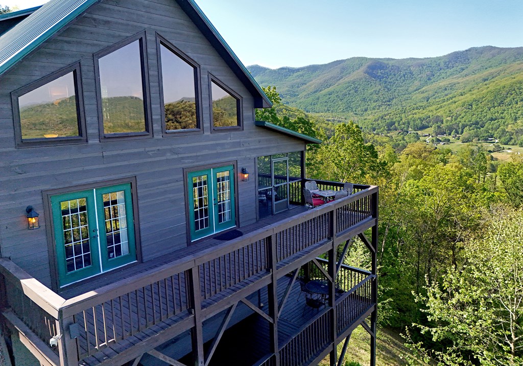299 Bethabara View Hayesville, NC 28904 - Photo 7 of 131 a view of a balcony with furniture and a potted plant