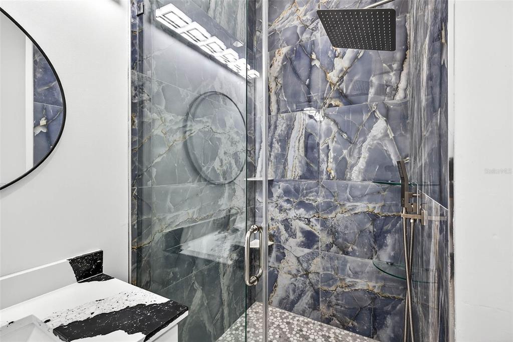 216 North Glen Arven Avenue Temple Terrace, FL 33617 - Photo 16 of 61 a bathroom with a shower and mirror
