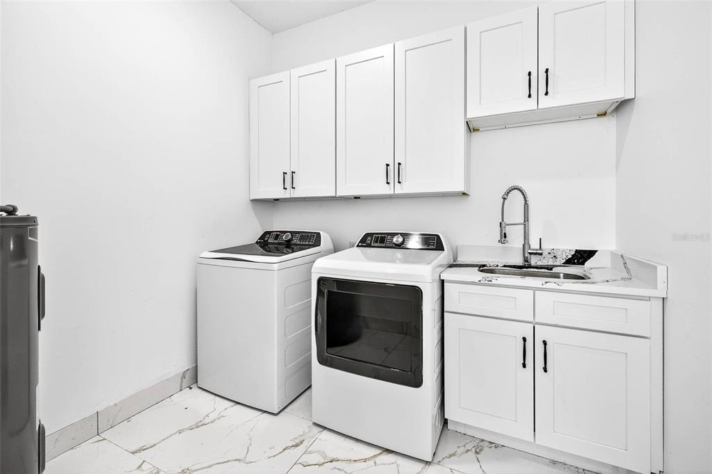 216 North Glen Arven Avenue Temple Terrace, FL 33617 - Photo 19 of 61 a kitchen with a sink and cabinets