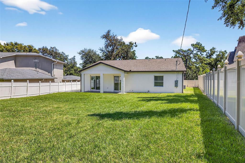 216 North Glen Arven Avenue Temple Terrace, FL 33617 - Photo 20 of 61 a view of a house with a back yard