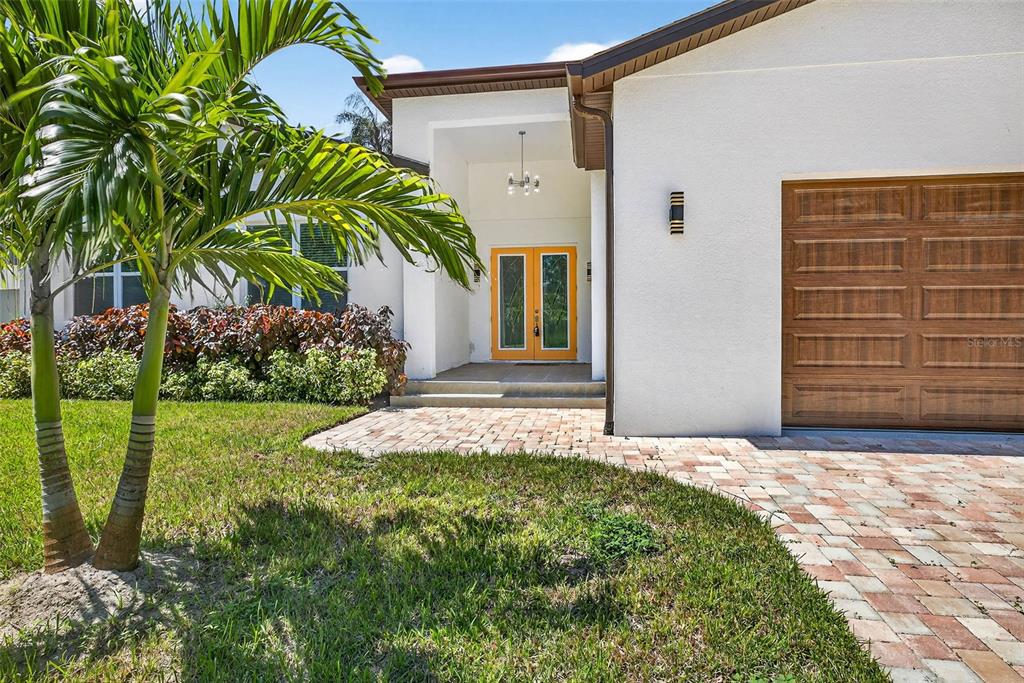 216 North Glen Arven Avenue Temple Terrace, FL 33617 - Photo 25 of 61 a front view of a house with garden