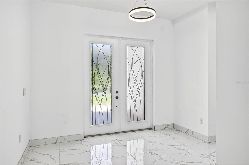 216 North Glen Arven Avenue Temple Terrace, FL 33617 - Photo 26 of 61 an empty room with windows
