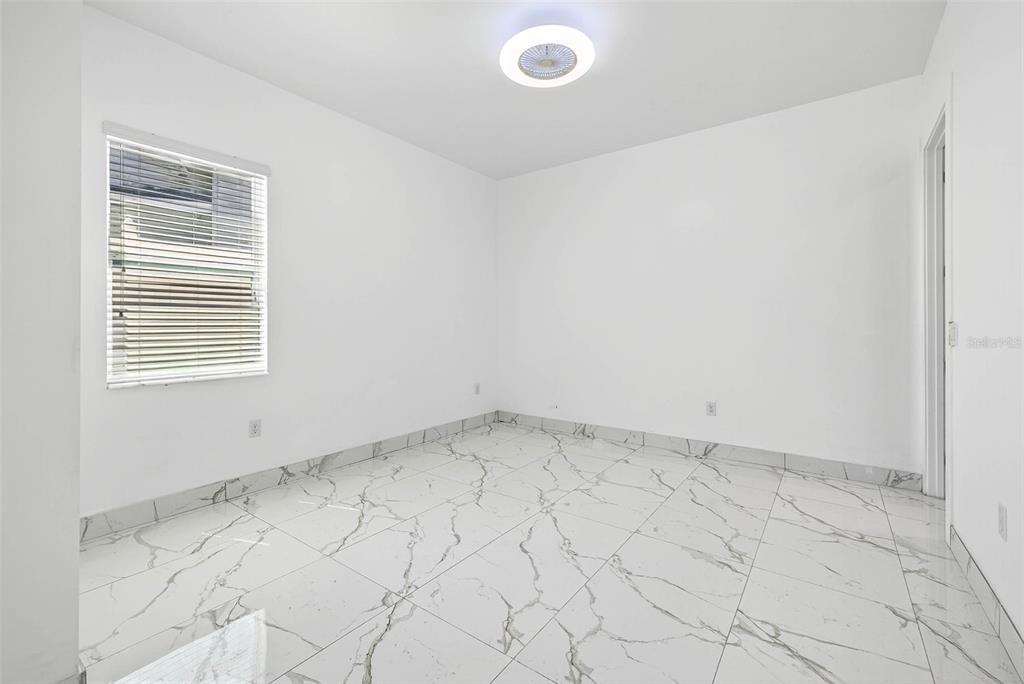 216 North Glen Arven Avenue Temple Terrace, FL 33617 - Photo 46 of 61 an empty room with a window
