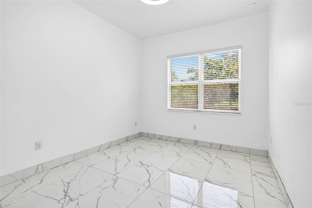 216 North Glen Arven Avenue Temple Terrace, FL 33617 - Photo 48 of 61 an empty room with a window