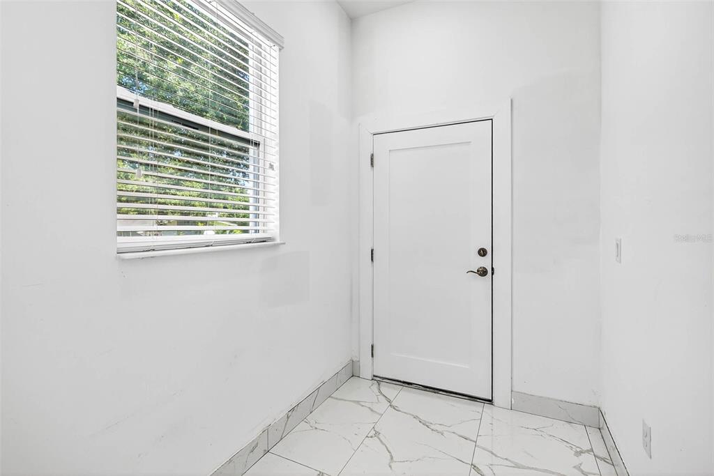 216 North Glen Arven Avenue Temple Terrace, FL 33617 - Photo 52 of 61 a view of an empty room with a window