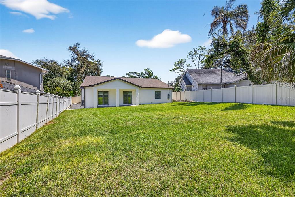 216 North Glen Arven Avenue Temple Terrace, FL 33617 - Photo 57 of 61 a house view with a sitting space and garden