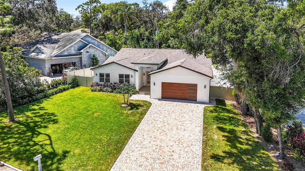 216 North Glen Arven Avenue Temple Terrace, FL 33617 - Photo 58 of 61 a view of house with garden