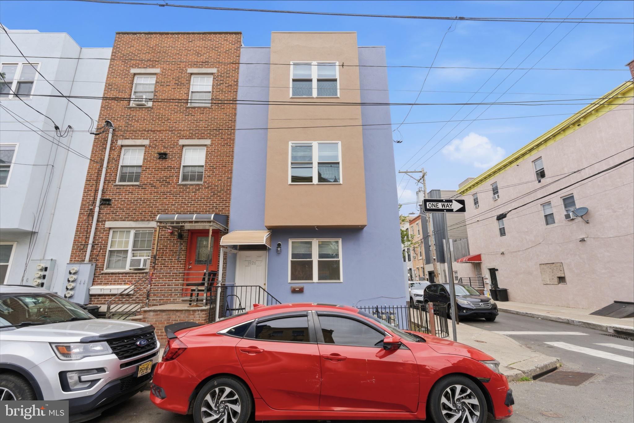 1926 South 7th Street, Unit 2 Philadelphia, PA 19148 - Photo 1 of 18 a front view of a house with parking space