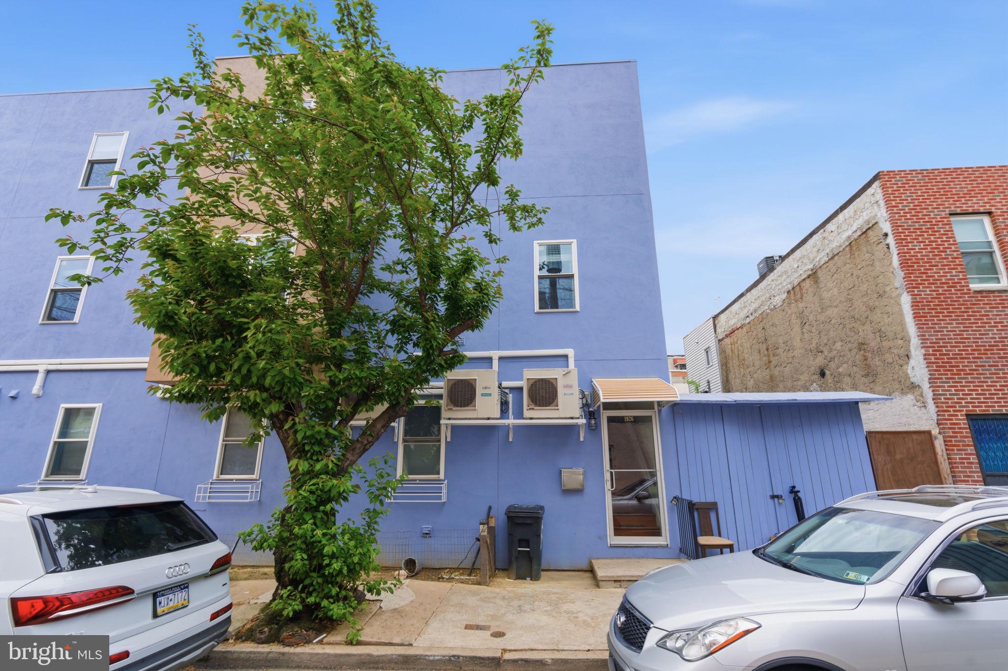 1926 South 7th Street, Unit 2 Philadelphia, PA 19148 - Photo 16 of 18 a front view of a house with a yard