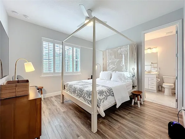 a living room with a bed furniture and a window