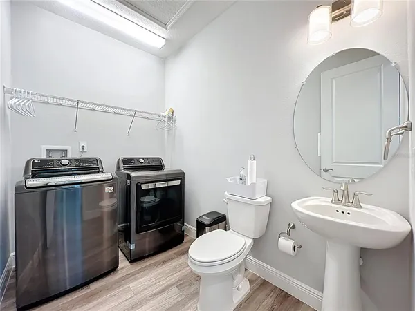 a bathroom with a sink toilet and vanity