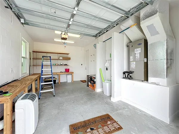 a bedroom with furniture and a chandelier