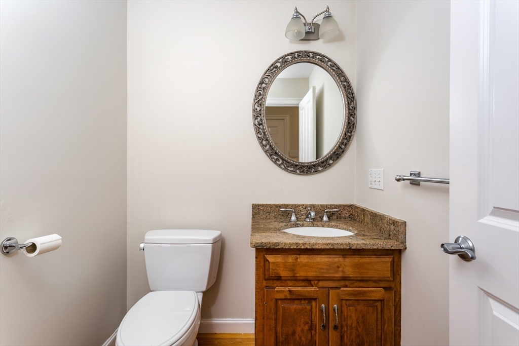 49 Beaver Street, Unit 49 Franklin, MA 02038 - Photo 14 of 46 a bathroom with a toilet and a sink